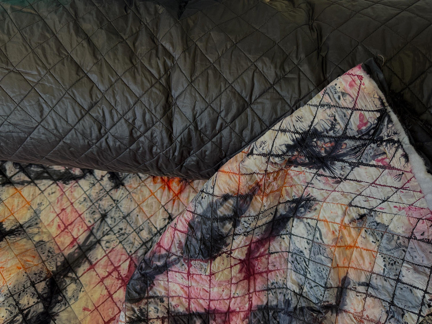 Double-Faced Reversible Pre-Quilted  Black/Camouflage color, Fabric. 54" wide, l 100% / polyester Fabric by The Yard