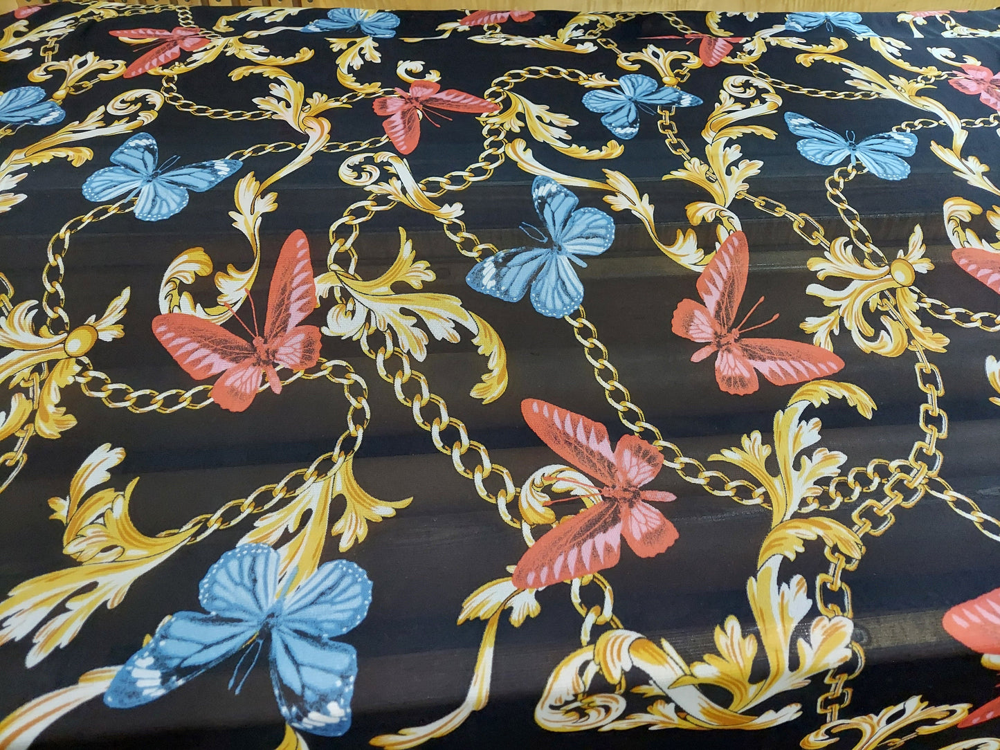 ad Power Mesh New chains with butterflies print on 4-way stretch mesh 58” Sold by the yard