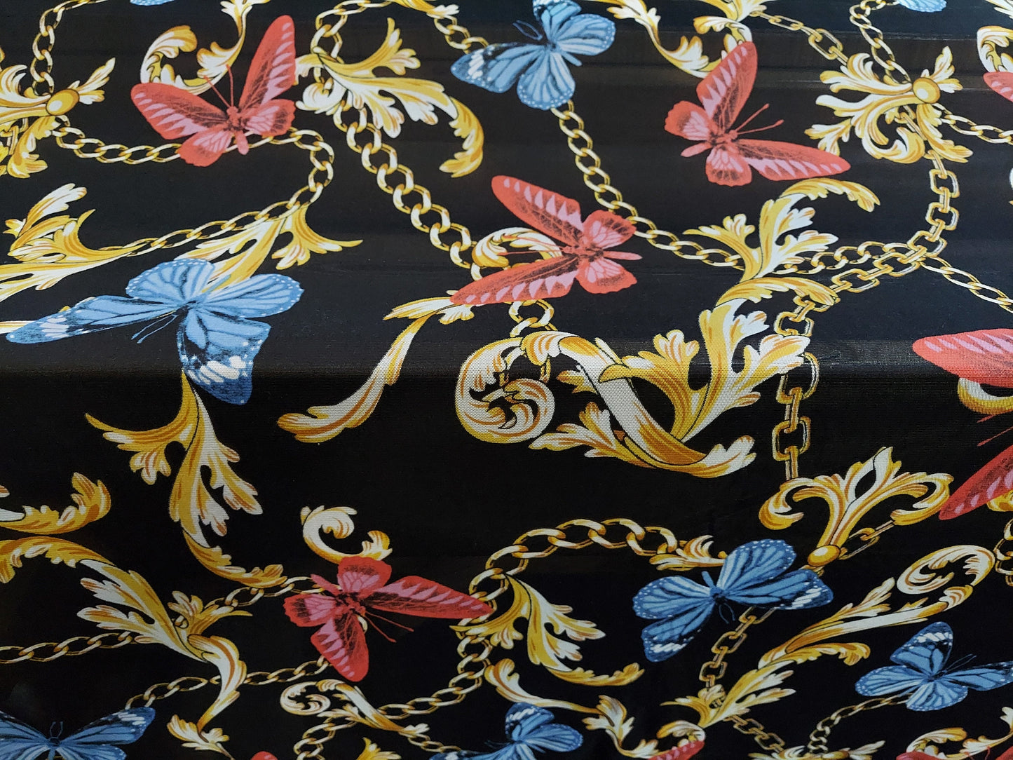 ad Power Mesh New chains with butterflies print on 4-way stretch mesh 58” Sold by the yard
