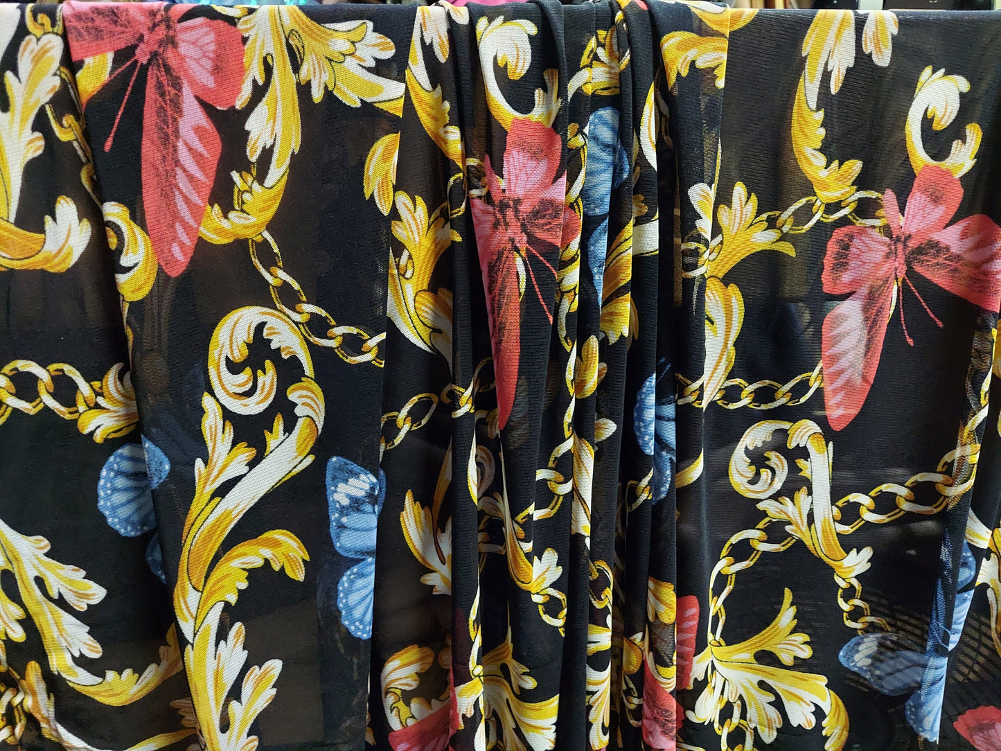 ad Power Mesh New chains with butterflies print on 4-way stretch mesh 58” Sold by the yard