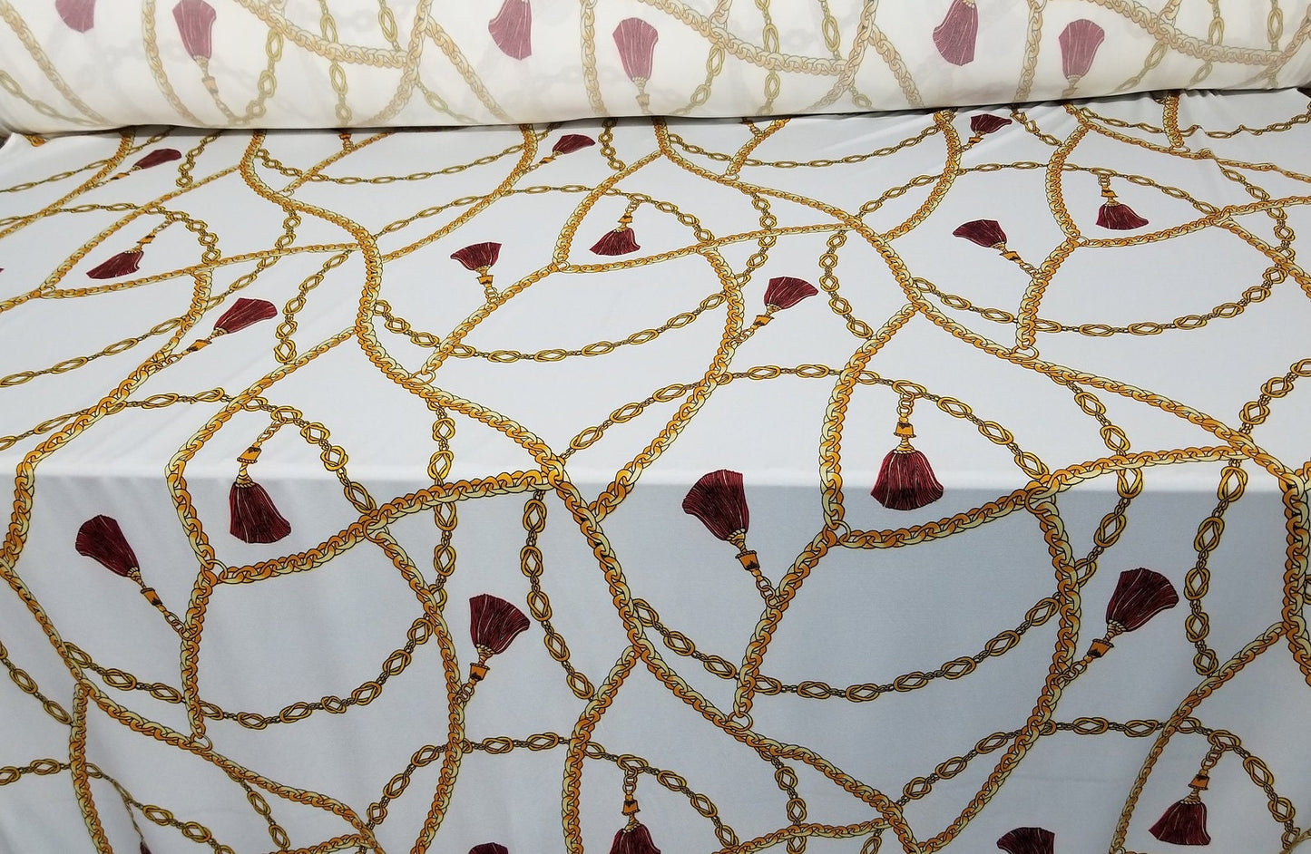 2 Way Stretch Scuba Techno, Color white/gold Chains, Belts and Ornaments burgundy, 58" wide, sold by yard in continuous yards